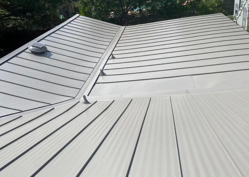 Solar attic fan installed on a metal roof for Roof Ventilation in Zephyrhills West